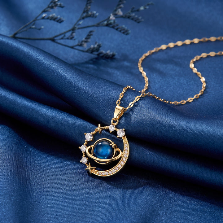 Astrea Orbit Necklace celestial pendant on blue satin