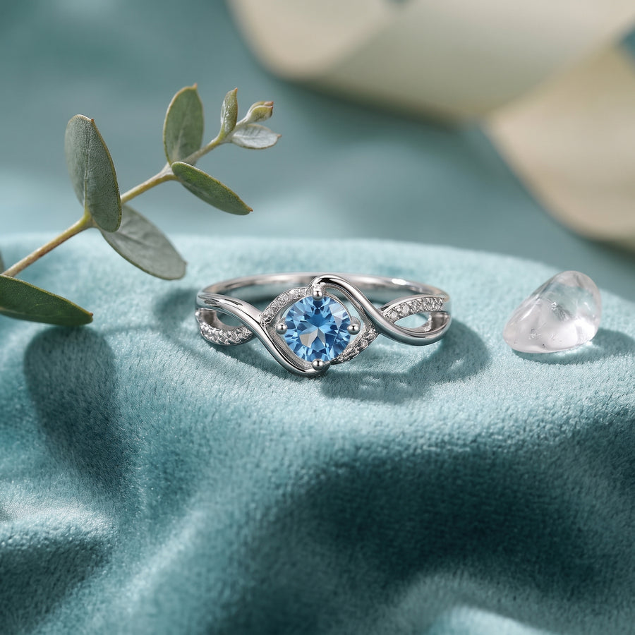 Lunara Wave Infinity Ring on champagne satin