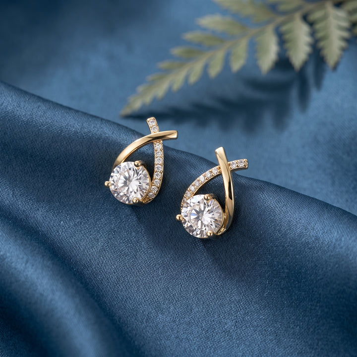 Lucienne Crystal Arc Studs in gold on fabric