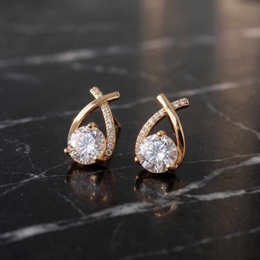 Lucienne Crystal Arc Studs in gold—styled setting