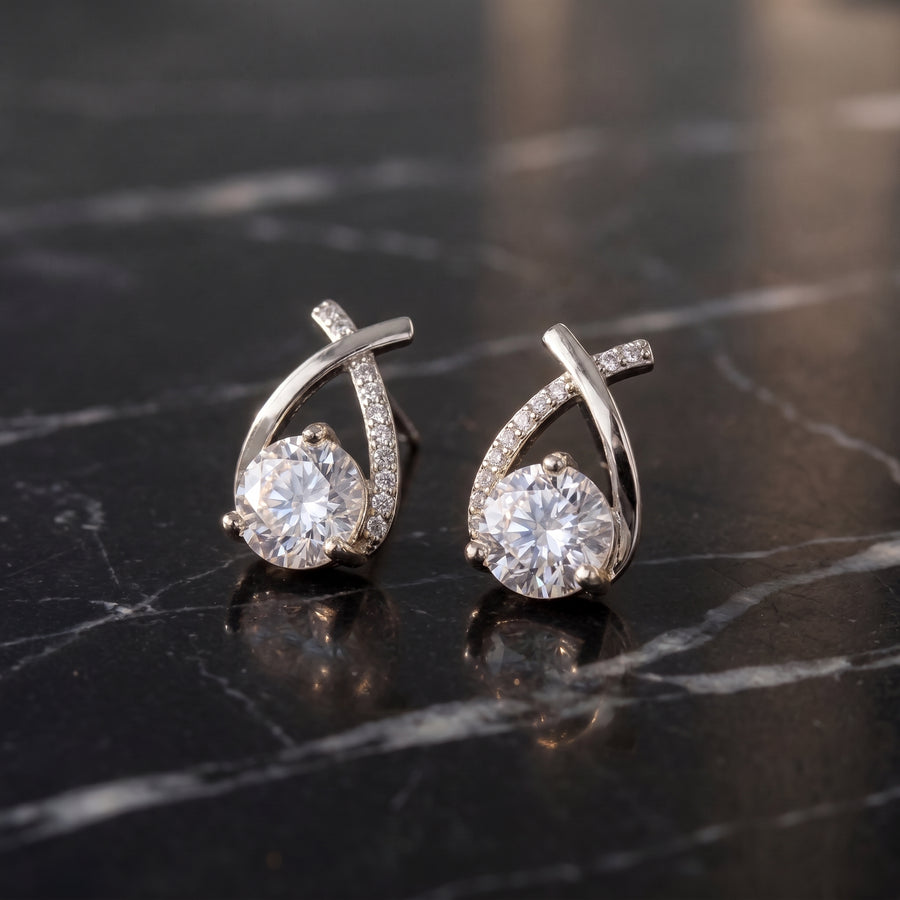 Lucienne Crystal Arc Studs in silver—styled setting
