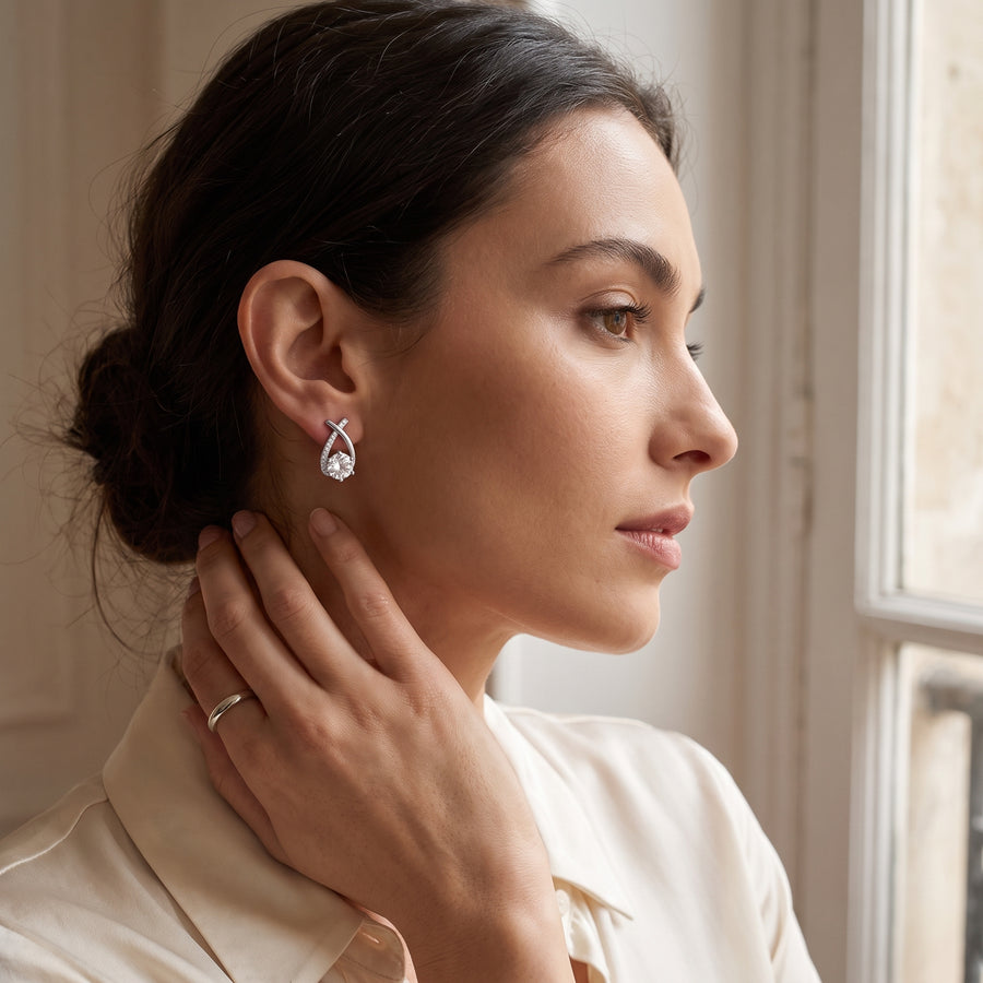 Lucienne Crystal Arc Studs in silver—worn view